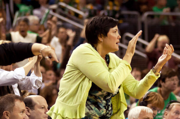 Karen Bryant (right) cheering on the Storm at KeyArena. Neil Enns/Storm Photos.