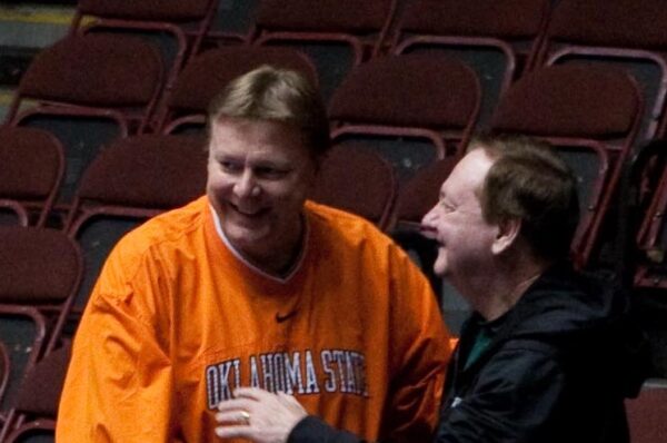 Kurt Budke jokes with Leon Barmore during the 2011 Big 12 tournament in March.